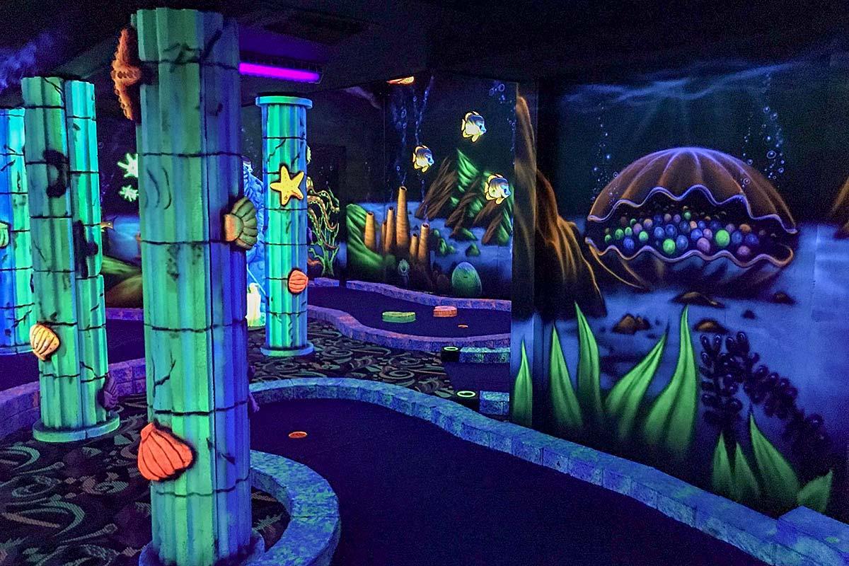 Play this black light nine hole course.