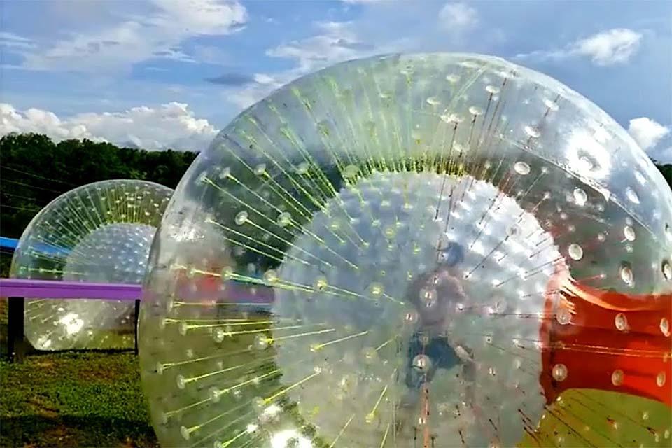 Race downhill in a large bouncy ball.